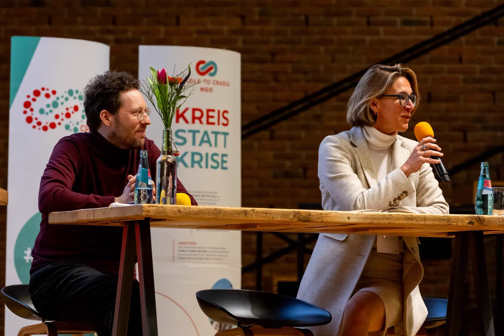 Two speakers discussing circular transformation at the Cradle to Cradle Congress